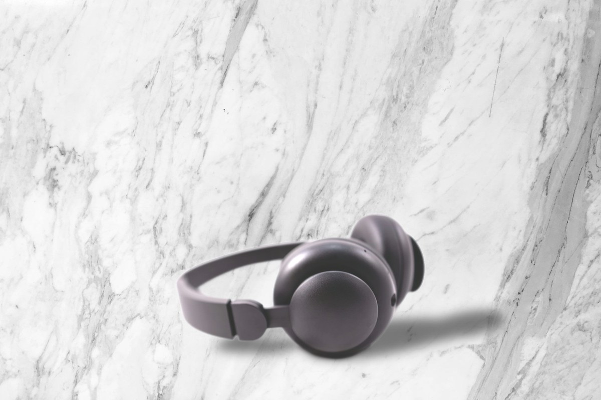 Black headphones on a marble scene